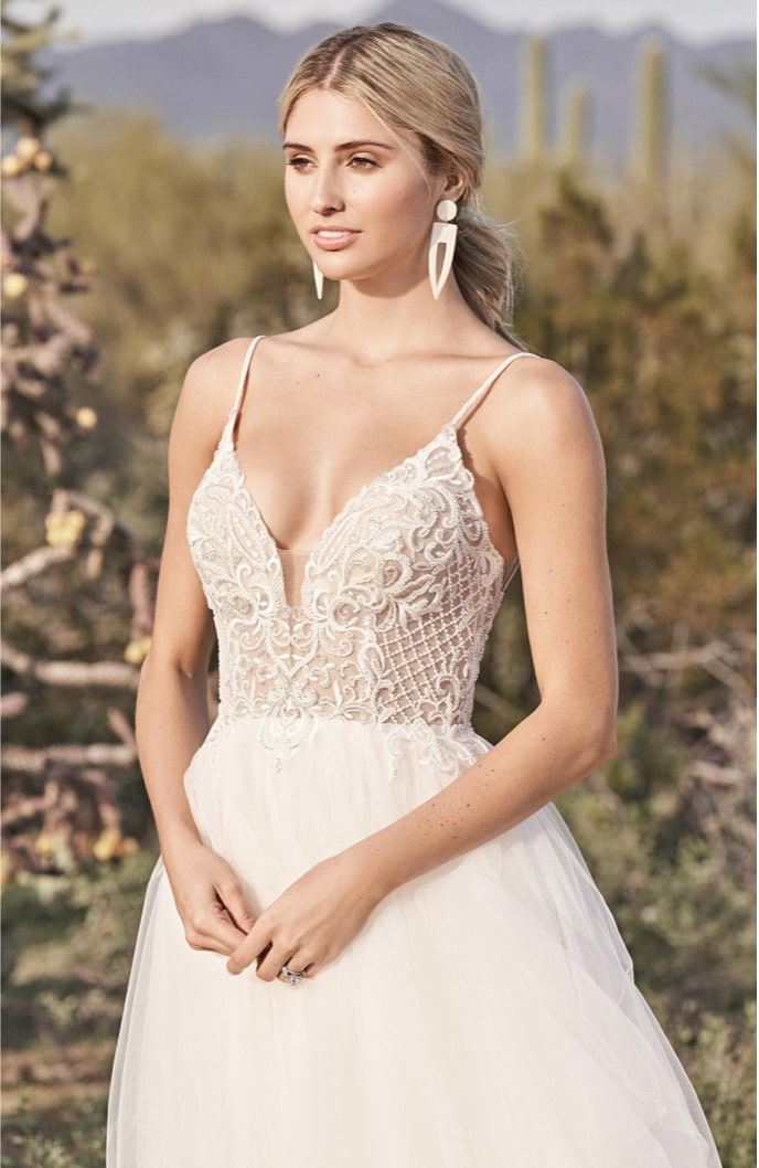 Model wearing a thin straps style gown