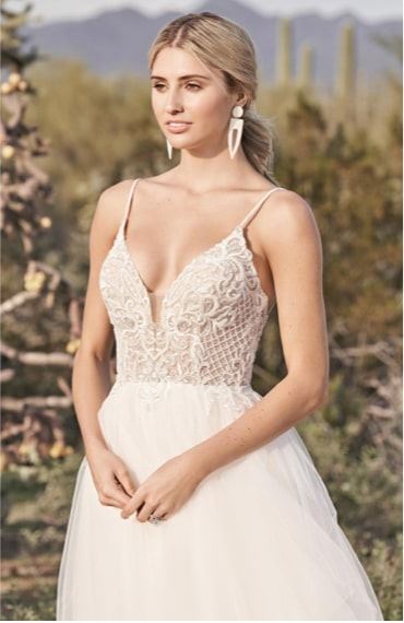 Model wearing a thin straps style gown