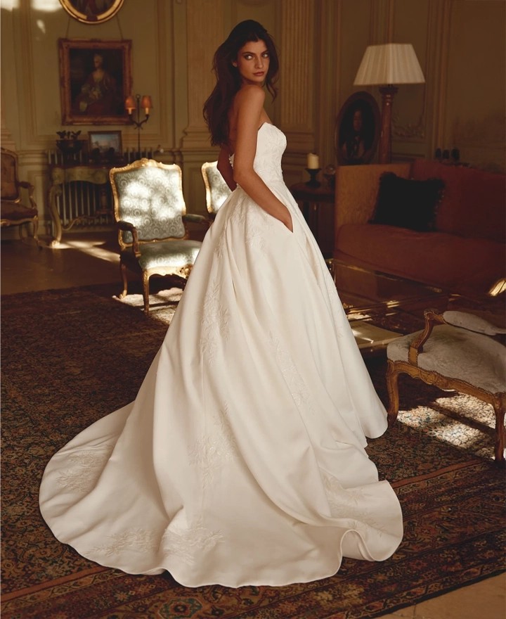 Model wearing a Justin Alexander Gown