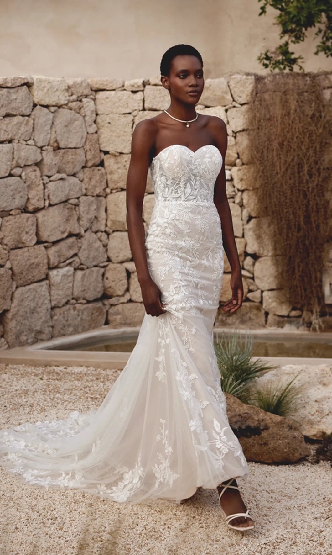 Model wearing a Lillian West gown